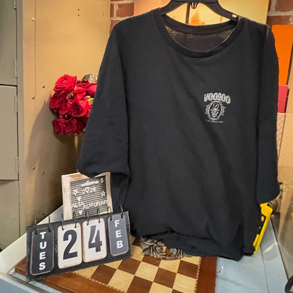 voodoo-themed graphic T-shirt features a design inspired by Bourbon Street's